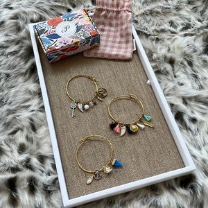 Plunder lot of three gold charm bracelets and one is ocean themed